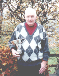 Denis with Golf Trophy